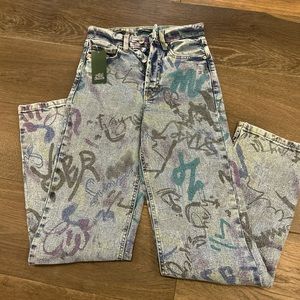 Blue denim jeans with graphic writing